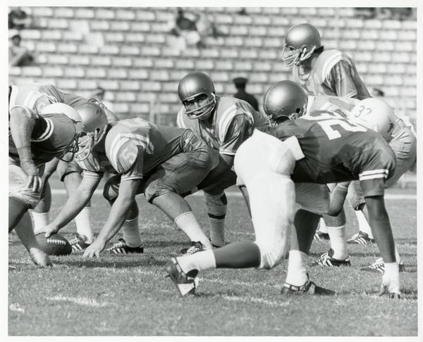UCLA Quarterback Mike flores (Center) gets his team set for a play agains the Texas Longhorns during game in the Coliseum, 1971