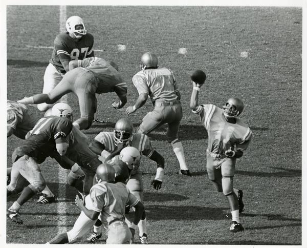 UCLA Quarterback Mike Flores (11), who completed 15 passes out of 36 attempts, fires one against the Texas Longhorns during game in the Coliseum, September 1971
