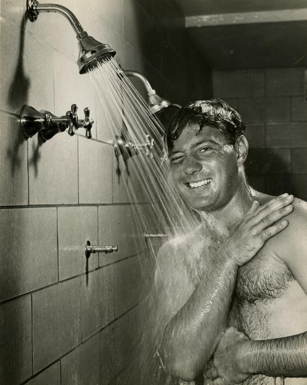 UCLA football player James Millette showering, 1947