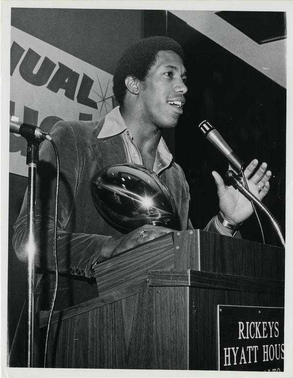 UCLA inside linebacker Jerry Robinson at the UCLA Award banquet receiving the All-American Pop Award, 1978