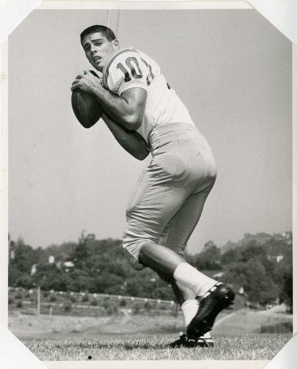 UCLA quarterback Steve Sindell looking back to pass, 1963
