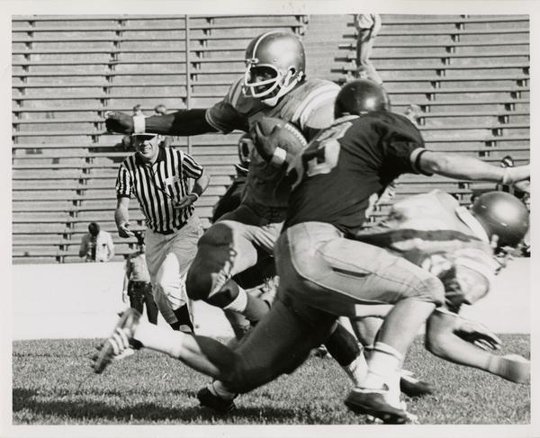 UCLA football player Larry Zeno running with the ball during a game