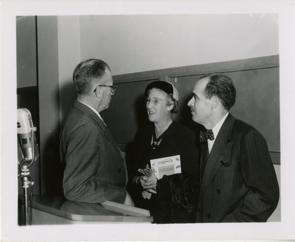 Lawrence Clark Powell with unidentified man and woman at Friends of the UCLA Library event