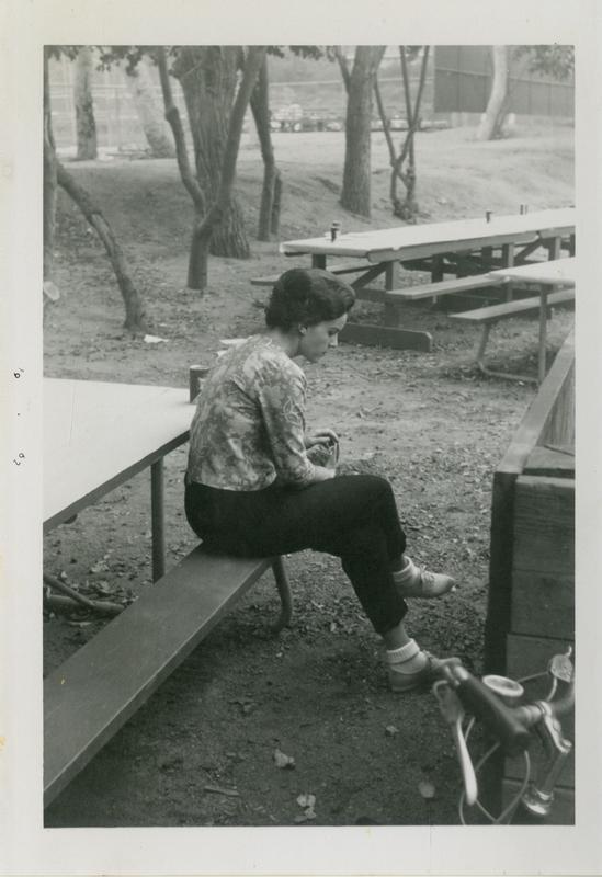 Woman sitting at the geography department picnic