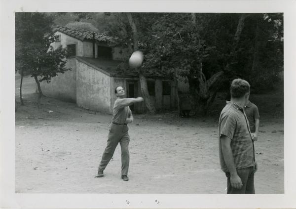 Man hitting a volleyball at the geography department picnic