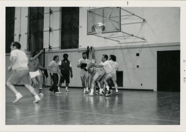 Members of the geography department playing basketball