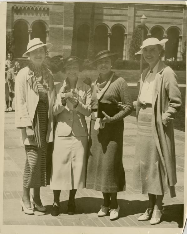 Elizabeth Lloynd Denis, Hansena Frederickson, Ann Sumner, and Albertina Rodi pose for a photo with Royce Hall in the background at the Gold Shield Alumnae of UCLA event, ca. 1937