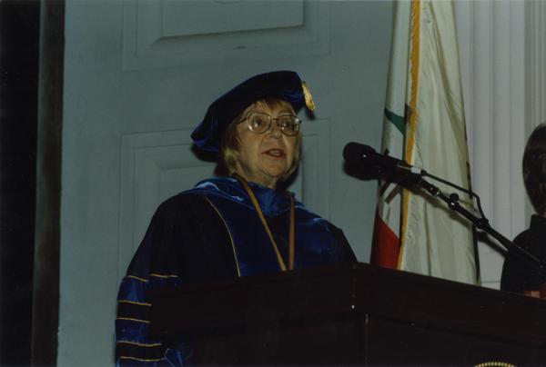 Victoria Fromkin at podium during PhD Hooding Ceremony, June 1988