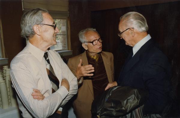 Joseph Gengerelli and Donald Lindsley speak with unidentified man at gathering for PhD Hooding Ceremony, June 1988