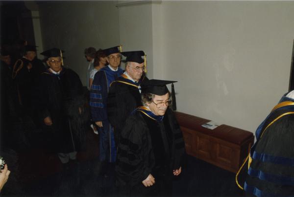 Bertram Russell, Russell O'Neill, Morley English and Isadore Rudnick line up for PhD Hooding Ceremony, June 1988