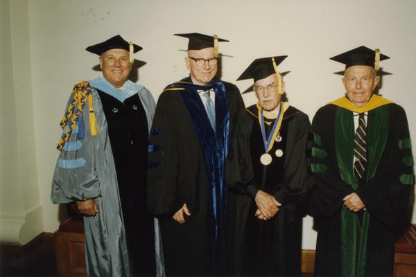 Norman Miller, Kenneth Bailey, Robert Vosper and Franklin Murphy gathered before the PhD Hooding Ceremony, June 1988