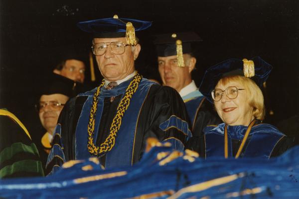 Adrian Harris, Chancellor Young, Elwin Svenson and Victoria Fromkin seated during PhD Hooding Ceremony, June 1988