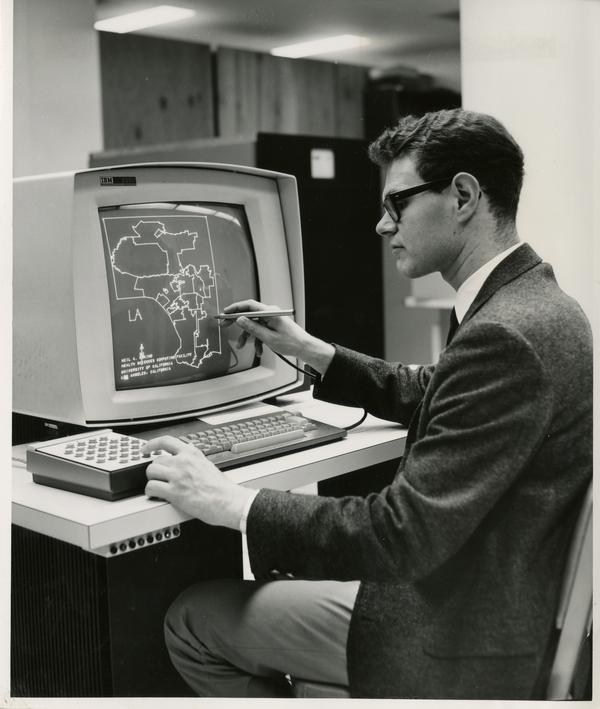 Man looks at epidemiological map on computer