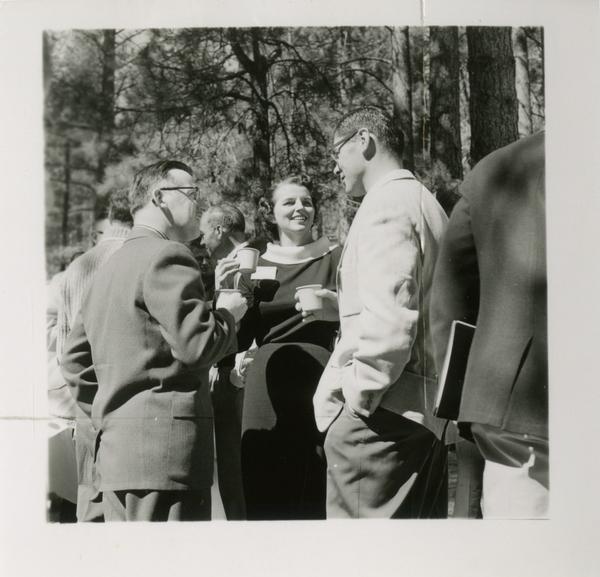 Group of three stand in conversation during a coffee break at Lake Arrowhead Lodge, March 1959