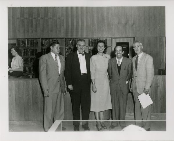 Louise Darling and Lawrence Clark Powell posing with others at Biomedical Library opening, October 26, 1954