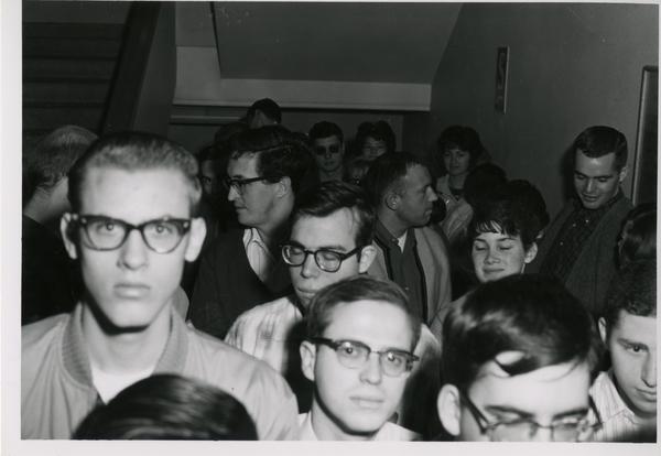 Crowd waiting in stair well for 1962 sale of library duplicates