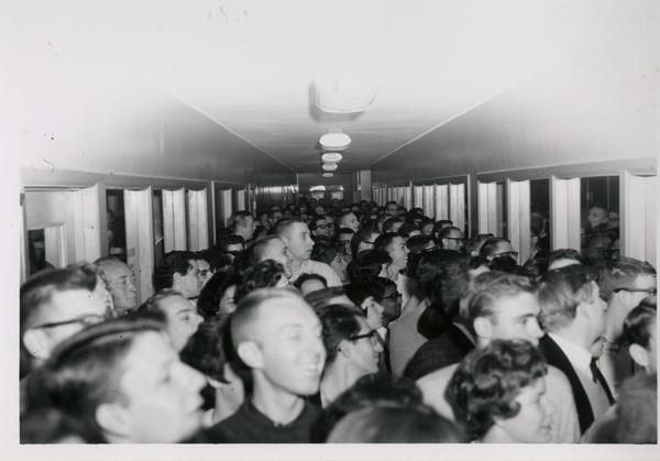 Crowd in hallway for 1962 sale of library duplicates