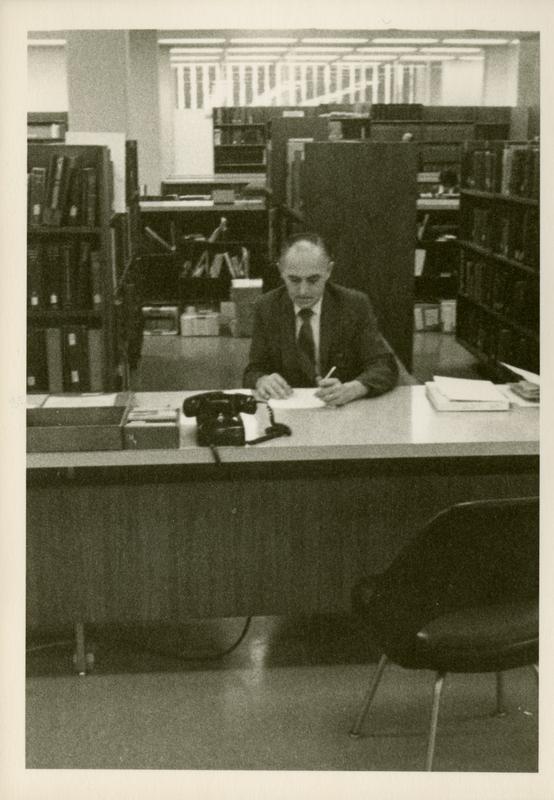 Reference Librarian sitting at desk