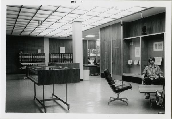 Patron sits in Library Special Collections reference area, ca. March 1976