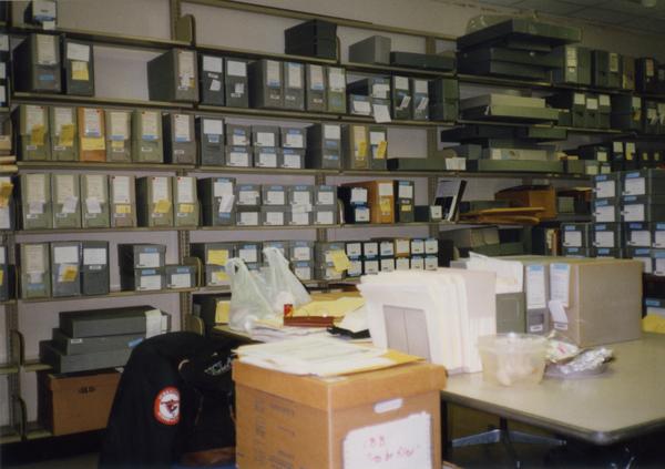 Shelves housing archival materials in Library Special Collections staff area, ca. 1997