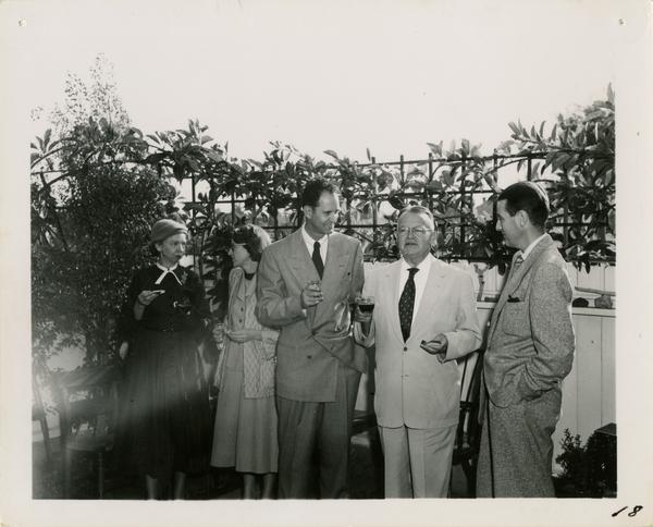 Photo of Irene Robinson, Ninon J. Smith, Richard Archer, Will Robinson, and Wilbur Smith at party