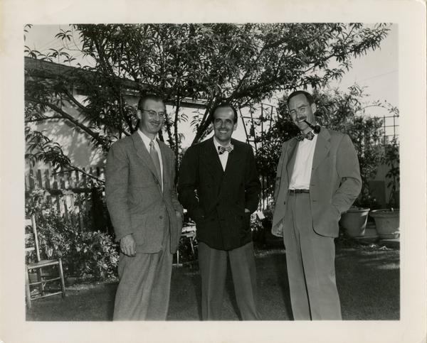 Andy Horn, Lawrence Clark Powell, and Robert Vosper at Library staff party
