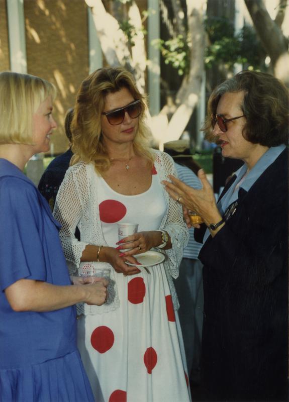 Library staff talking to each other at a party, ca. 1991
