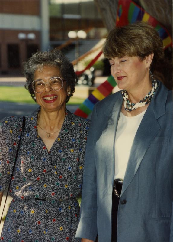 Two library staff members pose for a photo at a staff event, ca. 1991
