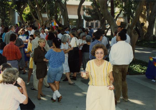 Library staff member poses for a photo at a staff event, ca. 1991