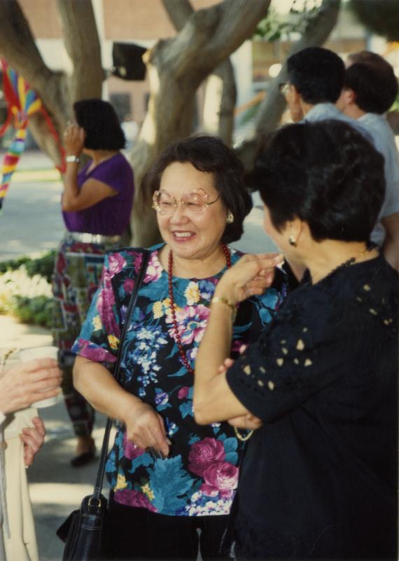 Candid shot of library staff laughing at a staff retirement party, 1991