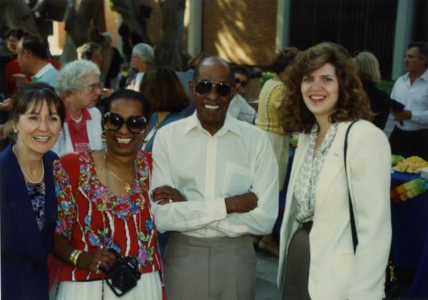 Library staff pose for a photo at the staff retirement party, 1991