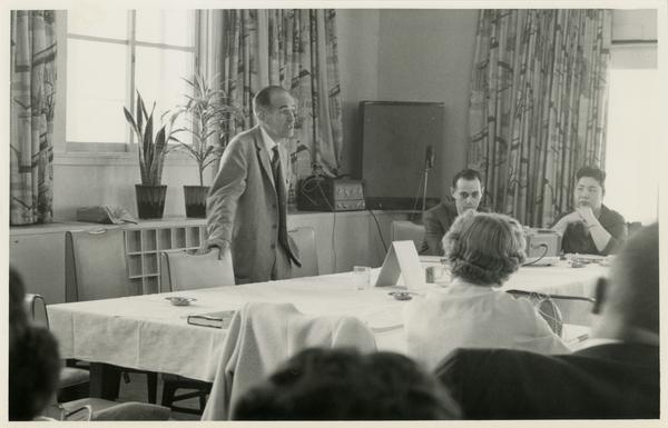 Lawrence Clark Powell addresses a crowd on a trip to Japan, ca. 1960