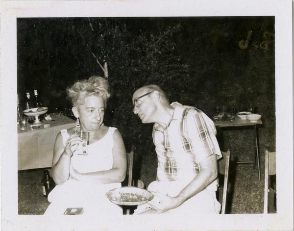 Bob Tussler and Betty Rosenberg talking at the fifth anniversary to the beginning of the School of Library Service, 1961