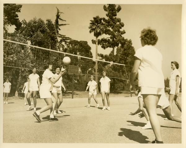 Women playing volleyball