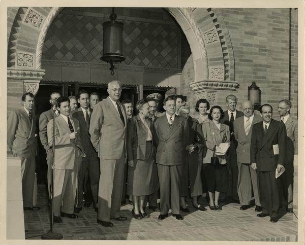 Dykstra, Dickson, Powell among crowd gathering outside of Powell Library east wing at dedication ceremony, ca. 1948