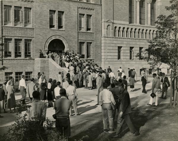 Crowd enters the newly opened east wing of Powell Library