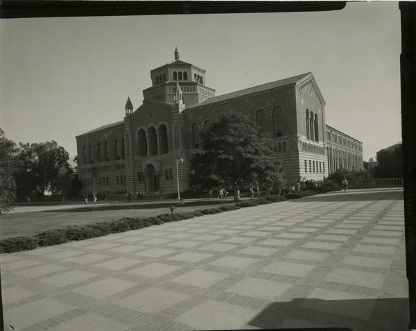 View of Powell Library as students walk by, ca. 1966