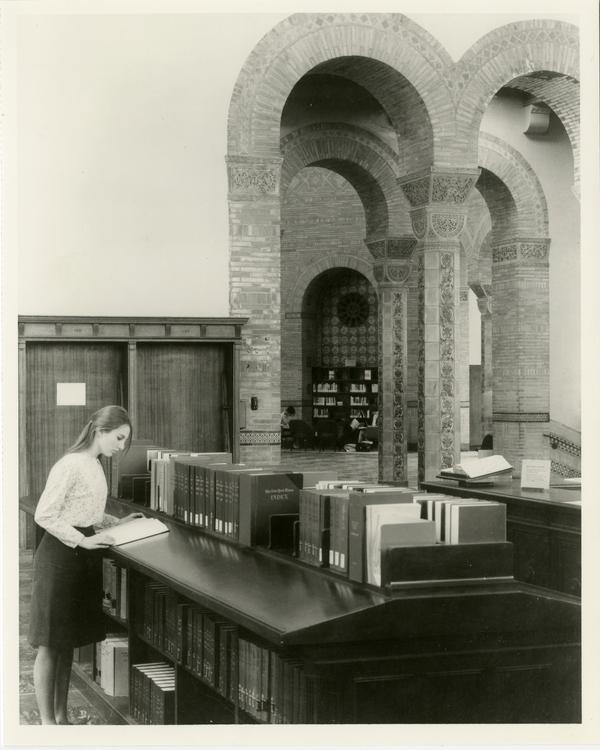 Student researching in main reading room