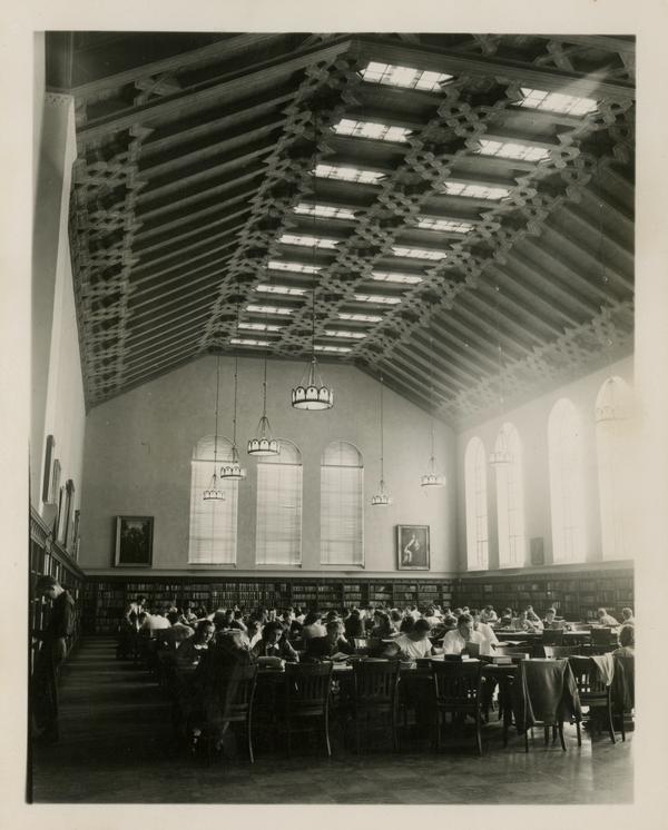Students studying in main reading room of Powell Library