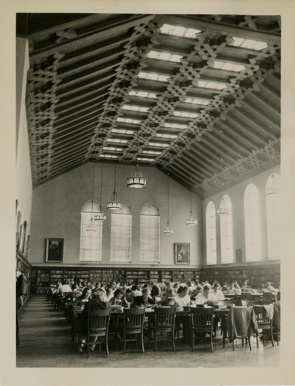 Students studying in main reading room of Powell Library