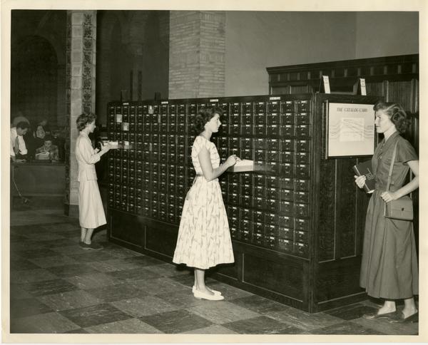 Students searching through card catalog, ca. 1950