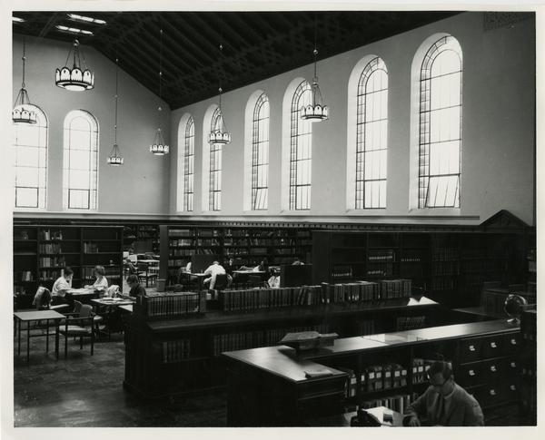 Looking west at corner of Reference desk and the Main reading room of Powell Library, 1968