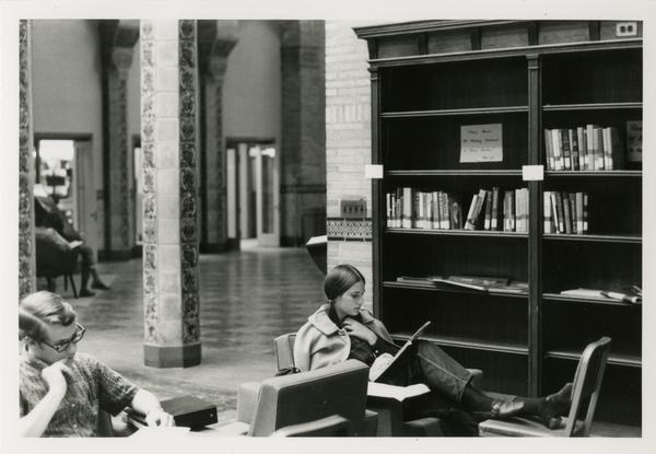Student reading a book in Powell