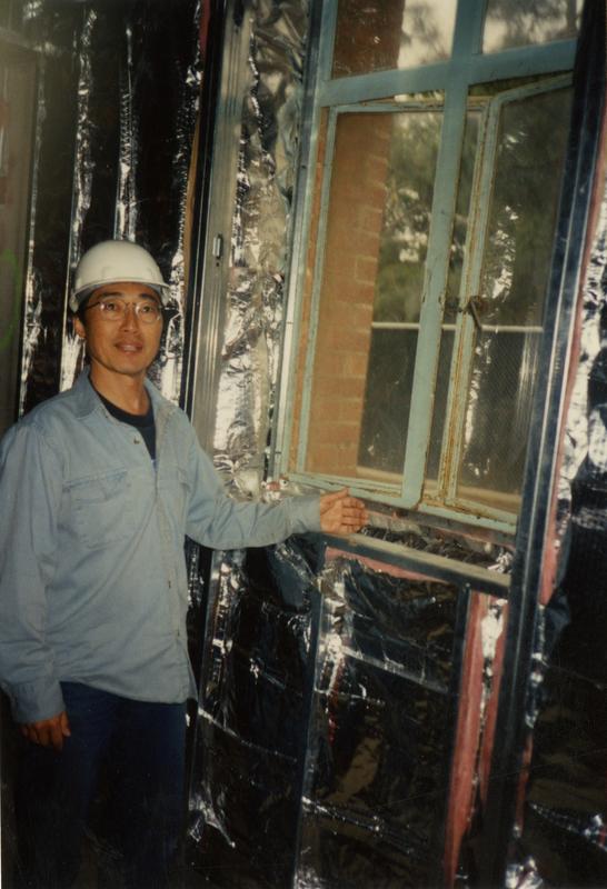 Steve Kunishima in front of the former Printing Office Window during renovation at Powell Library