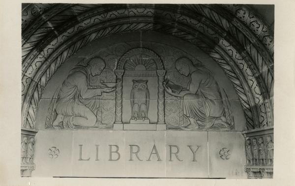Stone carvings above Powell Library entrance