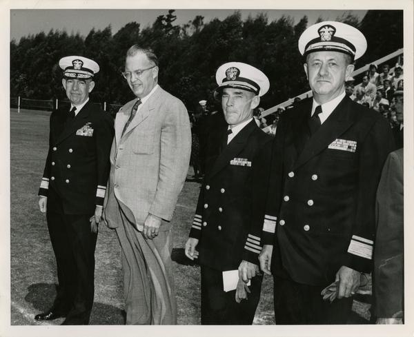 Rear Admiral George C. Dyer, Chancellor Raymond B. Allen, Captain Joseph W. Adams, and Rear Admiral. C.L. C. Atkeson waiting for annual review of NROTC unit, June 5, 1954