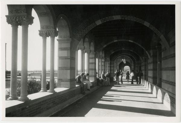 View of people within arcade of Royce Hall