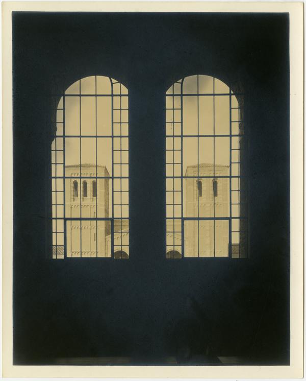 Looking through Powell Library windows at Royce Hall Towers, 1930