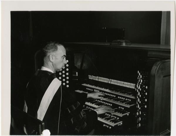 Lawrence Petran sitting at organ