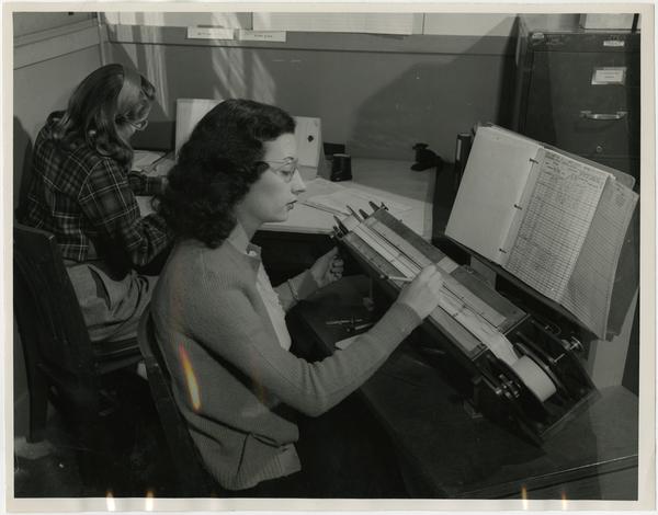 Laboratory technicians, Elizabeth Ann Little and Gail Slack assembling statistics from 35mm recordings of sound made in an oscillograph aboard the SS "Scripps", ca. 1946